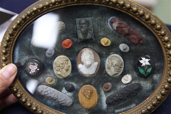 A collection of Italian Grand Tour lava, cameo and pietra dura roundels and plaques, 8.75in.